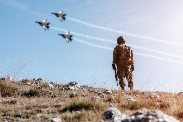 Soldier,Standing,On,A,Mountain,Looking,At,A,Shadow,Of
