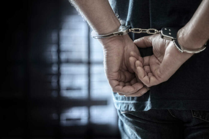 Arrested,Man,In,Handcuffs,With,Handcuffed,Hands,Behind,Back,In