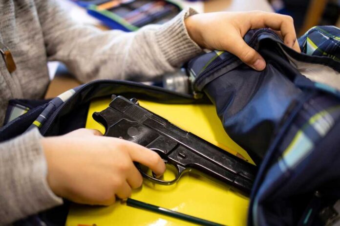Active,Shooter,Taking,Gun,In,Classroom,Ready,For,Mass,School