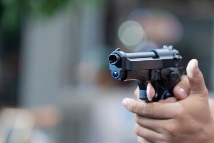 Man,Holding,Gun,Aiming,Pistol,In,Hand,Ready,To,Shoot.