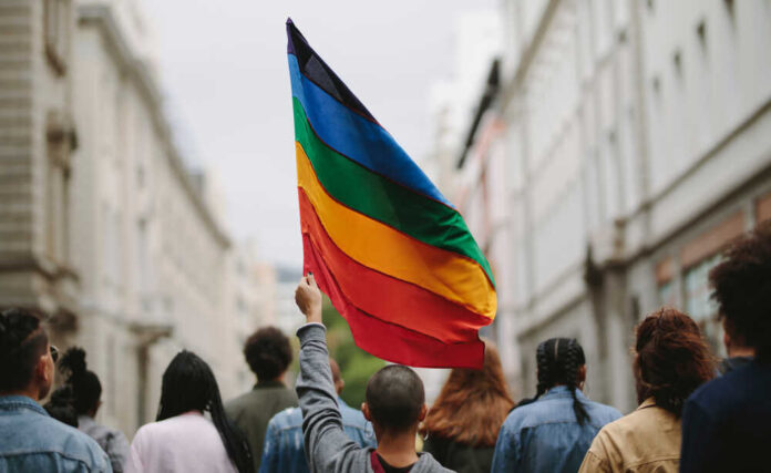 Rear,View,Of,People,In,The,Pride,Parade.,Group,Of