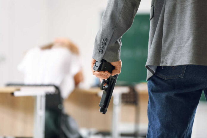 Male,Terrorist,With,Gun,In,Classroom.,Problem,Of,Shooting,At