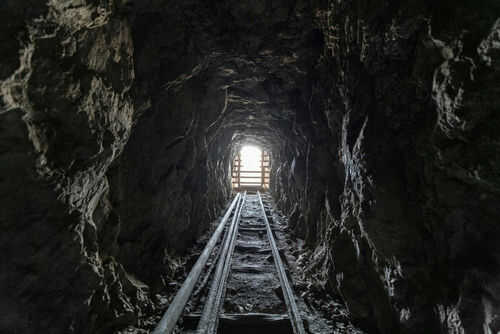 abandoned-mine2333229453jpg Dark tunnel leading to bright exit with tracks