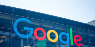 Google logo on glass building facade.