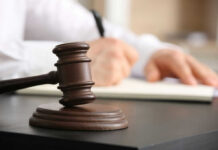 gavel, a man holding a pen