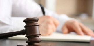 gavel, a man holding a pen