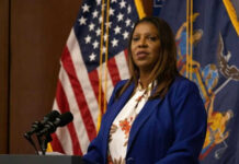 Federal Referrals Target NY AG Over Fraud Claims Woman speaking at a podium with flags behind her