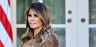 woman in brown trench coat