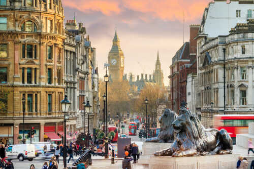View of London with Big Ben in the background and lion statues in the foreground