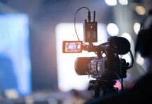 Close-up of a video camera set up for filming