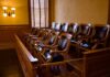 Empty jury box with wooden chairs in a courtroom