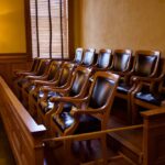 Empty jury box with wooden chairs in a courtroom