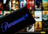 Mobile device displaying the Paramount Plus logo with a movie selection in the background