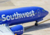 Southwest Airlines airplane on airport tarmac.