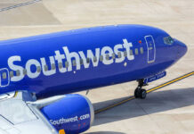 Southwest Airlines airplane on airport tarmac.