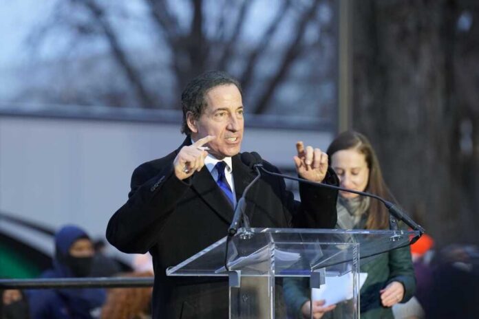 shutterstock_2102528650.jpg A man speaking passionately at a podium during an outdoor event