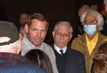 A group of people engaged in a discussion at a political event