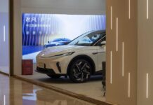 A sleek electric vehicle displayed in a modern showroom