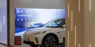 A sleek electric vehicle displayed in a modern showroom