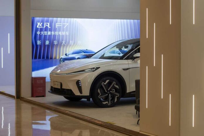 A sleek electric vehicle displayed in a modern showroom