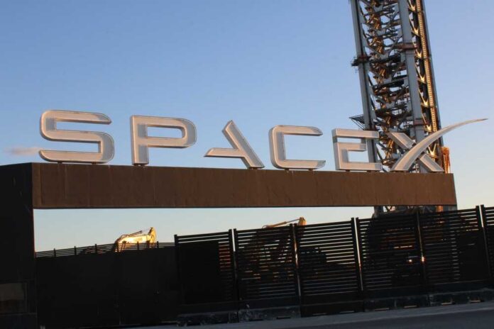 Sign displaying the SpaceX logo at a launch site