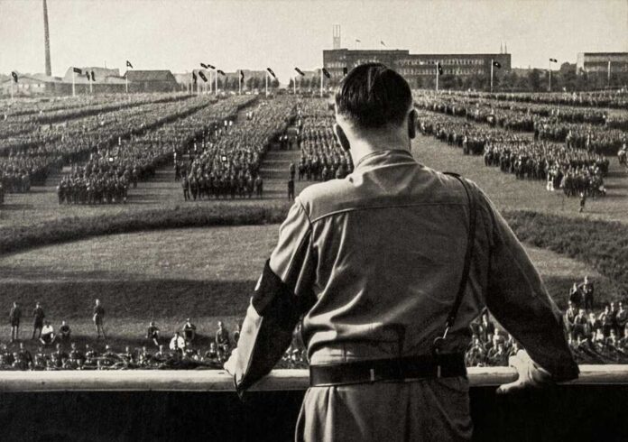 A historical figure overlooking a large military gathering