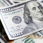 Several US one hundred dollar bills