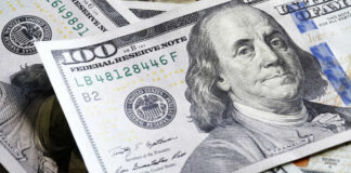 Several US one hundred dollar bills