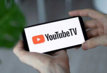 Hands holding phone with YouTube TV logo displayed
