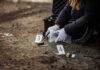 Decades-Old Mystery: Kristin Smart Case Breakthrough Person collecting evidence at a crime scene outdoors