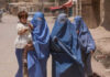 Critics Blast BBC for Downplaying Child Exploitation Three women in burqas walking with a child