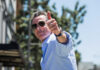 Man giving a thumbs up while wearing sunglasses