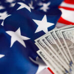 Willett Slammed: Taxpayer Funds for Gay Rodeo? American flag with hundred dollar bills