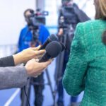 Mayor’s Staff Shut Down Questions – Transparency At Stake Hands holding microphones in front of a person at a press conference