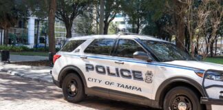 Police car parked on a brick street in Tampa