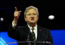 A speaker passionately addressing an audience at a conference