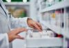 CONTROVERSIAL Abortion Pill Mandate: Will Colleges Comply? Pharmacist organizing medication on a shelf