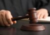 No Prison?! LA Counselor’s Abuse Deal Stuns A judge's hand holding a gavel above a wooden block