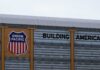 Migrant Horror: Deadly Boxcar Secrets Exposed Union Pacific railroad sign displaying 'Building America'