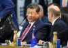 Trump’s China FLEX—What’s The Catch? Two political leaders engaged in conversation at a conference