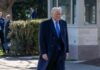 Power Play: Trump Crowns A Frontrunner A man in a formal suit walking outdoors