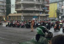 Rail Disaster Strikes Bangkok Again! City street with burning buses and cars at night