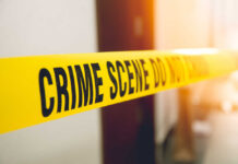 How Did We Get Here? Daughter Murdered Both Parents for Blocking Gender Surgery Yellow crime scene tape with the words 'CRIME SCENE DO NOT CROSS'