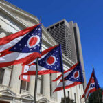 Senate Control Crisis: Ohio’s Decisive Vote Ohio state flags waving in front of a government building under a clear blue sky