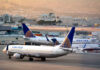 Hijack Code Triggered on United Flight — Incident Under Scrutiny Airplanes parked at airport terminal with United branding