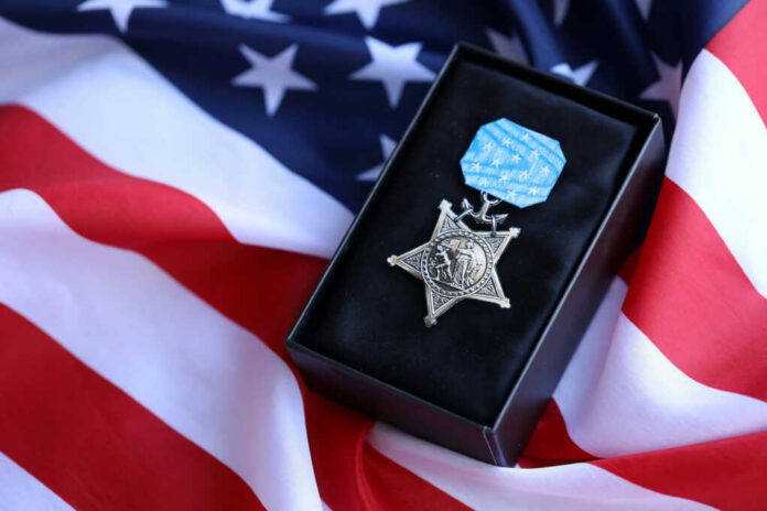 us-navy-medal-of-honor2499052095jpg Medal of Honor on American flag background