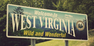 West Virginia welcome sign with scenic background