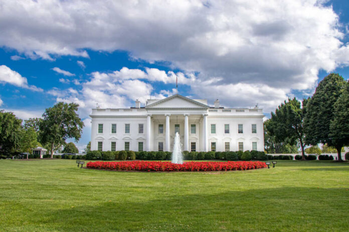 white-house-in-washington2463866197jpg The White House with fountain and lawn under a partly cloudy sky