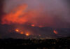 Wildfire Blamestorm—But Where Are The Logs? Wildfire lighting up the night sky over hills
