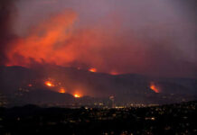 Wildfire Blamestorm—But Where Are The Logs? Wildfire lighting up the night sky over hills